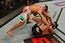 LAS VEGAS, NV - MAY 26:  Diego Brandao (top) punches Darren Elkins during a featherweight bout at UFC 146 at MGM Grand Garden Arena on May 26, 2012 in Las Vegas, Nevada.  (Photo by Donald Miralle/Zuffa LLC/Zuffa LLC via Getty Images)
