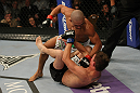 LAS VEGAS, NV - MAY 26:  Diego Brandao (top) punches Darren Elkins during a featherweight bout at UFC 146 at MGM Grand Garden Arena on May 26, 2012 in Las Vegas, Nevada.  (Photo by Donald Miralle/Zuffa LLC/Zuffa LLC via Getty Images)