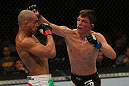 LAS VEGAS, NV - MAY 26:  Darren Elkins (R) punches Diego Brandao during a featherweight bout at UFC 146 at MGM Grand Garden Arena on May 26, 2012 in Las Vegas, Nevada.  (Photo by Donald Miralle/Zuffa LLC/Zuffa LLC via Getty Images)