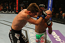 LAS VEGAS, NV - MAY 26:  Diego Brandao (R) punches Darren Elkins during a featherweight bout at UFC 146 at MGM Grand Garden Arena on May 26, 2012 in Las Vegas, Nevada.  (Photo by Donald Miralle/Zuffa LLC/Zuffa LLC via Getty Images)