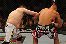 LAS VEGAS, NV - MAY 26:  Roy Nelson (left) punches Dave Herman during a heavyweight bout at UFC 146 at MGM Grand Garden Arena on May 26, 2012 in Las Vegas, Nevada.  (Photo by Donald Miralle/Zuffa LLC/Zuffa LLC via Getty Images)