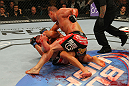 LAS VEGAS, NV - MAY 26:  Cain Velasquez (top) punches Antonio Silva during a heavyweight bout at UFC 146 at MGM Grand Garden Arena on May 26, 2012 in Las Vegas, Nevada.  (Photo by Donald Miralle/Zuffa LLC/Zuffa LLC via Getty Images)