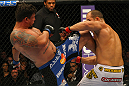LAS VEGAS, NV - MAY 26:  Frank Mir (L) kicks Junior dos Santos during the Heavyweight Championship bout at UFC 146 at MGM Grand Garden Arena on May 26, 2012 in Las Vegas, Nevada. (Photo by Donald Miralle/Zuffa LLC/Zuffa LLC via Getty Images)