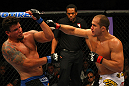 LAS VEGAS, NV - MAY 26:  Junior dos Santos (R) punches Frank Mir during the Heavyweight Championship bout at UFC 146 at MGM Grand Garden Arena on May 26, 2012 in Las Vegas, Nevada. (Photo by Donald Miralle/Zuffa LLC/Zuffa LLC via Getty Images)