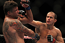 LAS VEGAS, NV - MAY 26:  (R-L) Junior dos Santos punches Frank Mir during the Heavyweight Championship bout at UFC 146 at MGM Grand Garden Arena on May 26, 2012 in Las Vegas, Nevada.  (Photo by Josh Hedges/Zuffa LLC/Zuffa LLC via Getty Images)
