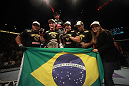 LAS VEGAS, NV - MAY 26:  Junior dos Santos (with belt) poses with his team after knocking out Frank Mir during the Heavyweight Championship bout at UFC 146 at MGM Grand Garden Arena on May 26, 2012 in Las Vegas, Nevada. (Photo by Donald Miralle/Zuffa LLC/Zuffa LLC via Getty Images)