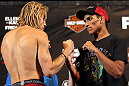 LAS VEGAS, NV - MAY 31:   (L-R) Opponents Jonathan Brookins and Charles Oliveira face off after making weight during The Ultimate Fighter Live weigh in at the Palms Casino Resort on May 31, 2012 in Las Vegas, Nevada.  (Photo by Josh Hedges/Zuffa LLC/Zuffa LLC via Getty Images)  *** Local Caption *** Jonathan Brookins; Charles Oliveira
