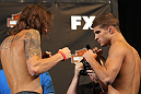 LAS VEGAS, NV - MAY 31:   (L-R) Opponents Michael Chiesa and Al Iaquinta face off after making weight during The Ultimate Fighter Live weigh in at the Palms Casino Resort on May 31, 2012 in Las Vegas, Nevada.  (Photo by Josh Hedges/Zuffa LLC/Zuffa LLC via Getty Images)  *** Local Caption *** Michael Chiesa; Al Iaquinta
