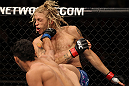 LAS VEGAS, NV - JUNE 01:   Charles Oliveira (bottom) punches Jonathan Brookins in a Featherweight bout during The Ultimate Fighter Live Finale at the Pearl Theater at the Palms Casino Resort on June 1, 2012 in Las Vegas, Nevada.  (Photo by Josh Hedges/Zuffa LLC/Zuffa LLC via Getty Images)  *** Local Caption *** Jonathan Brookins; Charles Oliveira
