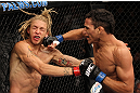 LAS VEGAS, NV - JUNE 01:   (R-L) Charles Oliveira punches Jonathan Brookins in a Featherweight bout during The Ultimate Fighter Live Finale at the Pearl Theater at the Palms Casino Resort on June 1, 2012 in Las Vegas, Nevada.  (Photo by Josh Hedges/Zuffa LLC/Zuffa LLC via Getty Images)  *** Local Caption *** Jonathan Brookins; Charles Oliveira
