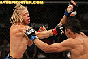 LAS VEGAS, NV - JUNE 01:   (L-R) Jonathan Brookins punches Charles Oliveira in a Featherweight bout during The Ultimate Fighter Live Finale at the Pearl Theater at the Palms Casino Resort on June 1, 2012 in Las Vegas, Nevada.  (Photo by Josh Hedges/Zuffa LLC/Zuffa LLC via Getty Images)  *** Local Caption *** Jonathan Brookins; Charles Oliveira