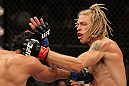 LAS VEGAS, NV - JUNE 01:   (R-L) Jonathan Brookins punches Charles Oliveira in a Featherweight bout during The Ultimate Fighter Live Finale at the Pearl Theater at the Palms Casino Resort on June 1, 2012 in Las Vegas, Nevada.  (Photo by Josh Hedges/Zuffa LLC/Zuffa LLC via Getty Images)  *** Local Caption *** Jonathan Brookins; Charles Oliveira