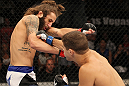 LAS VEGAS, NV - JUNE 01:   (R-L) Al Iaquinta punches Michael Chiesa in a Lightweight bout during The Ultimate Fighter Live Finale at the Pearl Theater at the Palms Casino Resort on June 1, 2012 in Las Vegas, Nevada.  (Photo by Josh Hedges/Zuffa LLC/Zuffa LLC via Getty Images)  *** Local Caption *** Al Iaquinta; Michael Chiesa