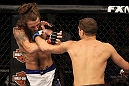 LAS VEGAS, NV - JUNE 01:   (R-L) Al Iaquinta punches Michael Chiesa in a Lightweight bout during The Ultimate Fighter Live Finale at the Pearl Theater at the Palms Casino Resort on June 1, 2012 in Las Vegas, Nevada.  (Photo by Josh Hedges/Zuffa LLC/Zuffa LLC via Getty Images)  *** Local Caption *** Al Iaquinta; Michael Chiesa