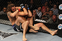 LAS VEGAS, NV - JUNE 01:   (L-R) Michael Chiesa attempts to submit Al Iaquinta in a Lightweight bout during The Ultimate Fighter Live Finale at the Pearl Theater at the Palms Casino Resort on June 1, 2012 in Las Vegas, Nevada.  (Photo by Josh Hedges/Zuffa LLC/Zuffa LLC via Getty Images)  *** Local Caption *** Al Iaquinta; Michael Chiesa