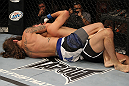 LAS VEGAS, NV - JUNE 01:   (L-R) Michael Chiesa attempts to submit Al Iaquinta in a Lightweight bout during The Ultimate Fighter Live Finale at the Pearl Theater at the Palms Casino Resort on June 1, 2012 in Las Vegas, Nevada.  (Photo by Josh Hedges/Zuffa LLC/Zuffa LLC via Getty Images)  *** Local Caption *** Al Iaquinta; Michael Chiesa