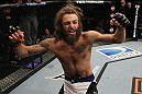 LAS VEGAS, NV - JUNE 01:   Michael Chiesa reacts to his submission victory in a Lightweight bout against Al Iaquinta during The Ultimate Fighter Live Finale at the Pearl Theater at the Palms Casino Resort on June 1, 2012 in Las Vegas, Nevada.  (Photo by Josh Hedges/Zuffa LLC/Zuffa LLC via Getty Images)  *** Local Caption *** Michael Chiesa