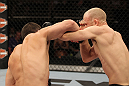 LAS VEGAS, NV - JUNE 01:   (L-R) Jake Ellenberger punches Martin Kampmann in a Welterweight bout during The Ultimate Fighter Live Finale at the Pearl Theater at the Palms Casino Resort on June 1, 2012 in Las Vegas, Nevada.  (Photo by Josh Hedges/Zuffa LLC/Zuffa LLC via Getty Images)  *** Local Caption *** Jake Ellenberger; Martin Kampmann