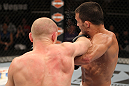 LAS VEGAS, NV - JUNE 01:   (L-R) Martin Kampmann punches Jake Ellenberger in a Welterweight bout during The Ultimate Fighter Live Finale at the Pearl Theater at the Palms Casino Resort on June 1, 2012 in Las Vegas, Nevada.  (Photo by Josh Hedges/Zuffa LLC/Zuffa LLC via Getty Images)  *** Local Caption *** Jake Ellenberger; Martin Kampmann