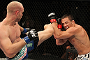 LAS VEGAS, NV - JUNE 01:   Martin Kampmann (left) kicks Jake Ellenberger in a Welterweight bout during The Ultimate Fighter Live Finale at the Pearl Theater at the Palms Casino Resort on June 1, 2012 in Las Vegas, Nevada.  (Photo by Josh Hedges/Zuffa LLC/Zuffa LLC via Getty Images)  *** Local Caption *** Jake Ellenberger; Martin Kampmann