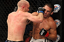 LAS VEGAS, NV - JUNE 01:   Martin Kampmann (left) punches Jake Ellenberger in a Welterweight bout during The Ultimate Fighter Live Finale at the Pearl Theater at the Palms Casino Resort on June 1, 2012 in Las Vegas, Nevada.  (Photo by Josh Hedges/Zuffa LLC/Zuffa LLC via Getty Images)  *** Local Caption *** Jake Ellenberger; Martin Kampmann