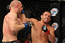 LAS VEGAS, NV - JUNE 01:   (R-L) Jake Ellenberger punches Martin Kampmann in a Welterweight bout during The Ultimate Fighter Live Finale at the Pearl Theater at the Palms Casino Resort on June 1, 2012 in Las Vegas, Nevada.  (Photo by Josh Hedges/Zuffa LLC/Zuffa LLC via Getty Images)  *** Local Caption *** Jake Ellenberger; Martin Kampmann