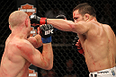 LAS VEGAS, NV - JUNE 01:   (R-L) Jake Ellenberger punches Martin Kampmann in a Welterweight bout during The Ultimate Fighter Live Finale at the Pearl Theater at the Palms Casino Resort on June 1, 2012 in Las Vegas, Nevada.  (Photo by Josh Hedges/Zuffa LLC/Zuffa LLC via Getty Images)  *** Local Caption *** Jake Ellenberger; Martin Kampmann