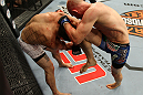 LAS VEGAS, NV - JUNE 01:   (R-L) Martin Kampmann hits Jake Ellenberger with a knee in a Welterweight bout during The Ultimate Fighter Live Finale at the Pearl Theater at the Palms Casino Resort on June 1, 2012 in Las Vegas, Nevada.  (Photo by Josh Hedges/Zuffa LLC/Zuffa LLC via Getty Images)  *** Local Caption *** Jake Ellenberger; Martin Kampmann