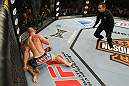 LAS VEGAS, NV - JUNE 01:   Martin Kampmann (blue shorts) attempts to finish Jake Ellenberger as referee Steve Mazzagatti (right) observes in a Welterweight bout during The Ultimate Fighter Live Finale at the Pearl Theater at the Palms Casino Resort on June 1, 2012 in Las Vegas, Nevada.  (Photo by Josh Hedges/Zuffa LLC/Zuffa LLC via Getty Images)  *** Local Caption *** Jake Ellenberger; Martin Kampmann