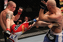 SUNRISE, FL - JUNE 08:   (L-R) Jake Hecht kicks Sean Pierson in Welterweight bout during the UFC on FX 3 event at Bank Atlantic Center on June 8, 2012 in Sunrise, Florida.  (Photo by Josh Hedges/Zuffa LLC/Zuffa LLC via Getty Images)