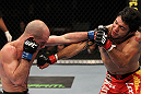 SUNRISE, FL - JUNE 08:   (R-L) Henry Martinez and Bernardo Magalhaes trade punches in Lightweight bout during the UFC on FX 3 event at Bank Atlantic Center on June 8, 2012 in Sunrise, Florida.  (Photo by Josh Hedges/Zuffa LLC/Zuffa LLC via Getty Images)