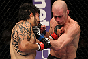 SUNRISE, FL - JUNE 08:   (L-R) Henry Martinez and Bernardo Magalhaes trade punches in Lightweight bout during the UFC on FX 3 event at Bank Atlantic Center on June 8, 2012 in Sunrise, Florida.  (Photo by Josh Hedges/Zuffa LLC/Zuffa LLC via Getty Images)