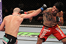 SUNRISE, FL - JUNE 08:   (R-L) Henry Martinez and Bernardo Magalhaes trade punches in Lightweight bout during the UFC on FX 3 event at Bank Atlantic Center on June 8, 2012 in Sunrise, Florida.  (Photo by Josh Hedges/Zuffa LLC/Zuffa LLC via Getty Images)