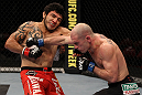 SUNRISE, FL - JUNE 08:   (L-R) Henry Martinez and Bernardo Magalhaes trade punches in Lightweight bout during the UFC on FX 3 event at Bank Atlantic Center on June 8, 2012 in Sunrise, Florida.  (Photo by Josh Hedges/Zuffa LLC/Zuffa LLC via Getty Images)