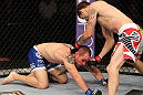SUNRISE, FL - JUNE 08:   (R-L) Tim Means punches Justin Salas in Lightweight bout during the UFC on FX 3 event at Bank Atlantic Center on June 8, 2012 in Sunrise, Florida.  (Photo by Josh Hedges/Zuffa LLC/Zuffa LLC via Getty Images)