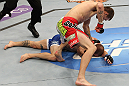 SUNRISE, FL - JUNE 08:   (R-L) Tim Means punches Justin Salas in Lightweight bout during the UFC on FX 3 event at Bank Atlantic Center on June 8, 2012 in Sunrise, Florida.  (Photo by Josh Hedges/Zuffa LLC/Zuffa LLC via Getty Images)