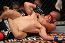 SUNRISE, FL - JUNE 08:   (R-L) Dustin Pague submits Jared Papazian with a rear choke in Bantamweight bout during the UFC on FX 3 event at Bank Atlantic Center on June 8, 2012 in Sunrise, Florida.  (Photo by Josh Hedges/Zuffa LLC/Zuffa LLC via Getty Images)