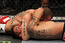 SUNRISE, FL - JUNE 08:   (L-R) Matt Grice attempts to submit Leonard Garcia with a choke in Featherweight bout during the UFC on FX 3 event at Bank Atlantic Center on June 8, 2012 in Sunrise, Florida.  (Photo by Josh Hedges/Zuffa LLC/Zuffa LLC via Getty Images)