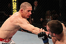 SUNRISE, FL - JUNE 08:   (L-R) Seth Baczynski punches Lance Benoist in a Welterweight bout during the UFC on FX 3 event at Bank Atlantic Center on June 8, 2012 in Sunrise, Florida.  (Photo by Josh Hedges/Zuffa LLC/Zuffa LLC via Getty Images)