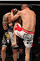 SUNRISE, FL - JUNE 08:   (R-L) Seth Baczynski knees Lance Benoist in a Welterweight bout during the UFC on FX 3 event at Bank Atlantic Center on June 8, 2012 in Sunrise, Florida.  (Photo by Josh Hedges/Zuffa LLC/Zuffa LLC via Getty Images)