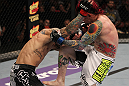 SUNRISE, FL - JUNE 08:   (R-L) Scott Jorgensen lands a knee against Eddie Wineland in a Bantamweight bout during the UFC on FX 3 event at Bank Atlantic Center on June 8, 2012 in Sunrise, Florida.  (Photo by Josh Hedges/Zuffa LLC/Zuffa LLC via Getty Images)