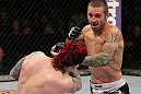 SUNRISE, FL - JUNE 08:   (R-L) Eddie Wineland punches Scott Jorgensen in a Bantamweight bout during the UFC on FX 3 event at Bank Atlantic Center on June 8, 2012 in Sunrise, Florida.  (Photo by Josh Hedges/Zuffa LLC/Zuffa LLC via Getty Images)