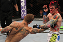 SUNRISE, FL - JUNE 08:   (L-R) Eddie Wineland punches Scott Jorgensen in a Bantamweight bout during the UFC on FX 3 event at Bank Atlantic Center on June 8, 2012 in Sunrise, Florida.  (Photo by Josh Hedges/Zuffa LLC/Zuffa LLC via Getty Images)