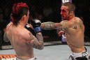 SUNRISE, FL - JUNE 08:   (R-L) Eddie Wineland punches Scott Jorgensen in a Bantamweight bout during the UFC on FX 3 event at Bank Atlantic Center on June 8, 2012 in Sunrise, Florida.  (Photo by Josh Hedges/Zuffa LLC/Zuffa LLC via Getty Images)