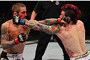 SUNRISE, FL - JUNE 08:   (L-R) Eddie Wineland and Scott Jorgensen trade punches in a Bantamweight bout during the UFC on FX 3 event at Bank Atlantic Center on June 8, 2012 in Sunrise, Florida.  (Photo by Josh Hedges/Zuffa LLC/Zuffa LLC via Getty Images)