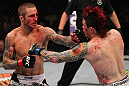 SUNRISE, FL - JUNE 08:   (L-R) Eddie Wineland punches Scott Jorgensen in a Bantamweight bout during the UFC on FX 3 event at Bank Atlantic Center on June 8, 2012 in Sunrise, Florida.  (Photo by Josh Hedges/Zuffa LLC/Zuffa LLC via Getty Images)