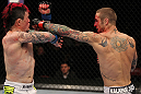 SUNRISE, FL - JUNE 08:   (R-L) Eddie Wineland punches Scott Jorgensen in a Bantamweight bout during the UFC on FX 3 event at Bank Atlantic Center on June 8, 2012 in Sunrise, Florida.  (Photo by Josh Hedges/Zuffa LLC/Zuffa LLC via Getty Images)
