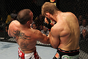 SUNRISE, FL - JUNE 08:   (L-R) Josh Neer punches Mike Pyle in a Welterweight bout during the UFC on FX 3 event at Bank Atlantic Center on June 8, 2012 in Sunrise, Florida.  (Photo by Josh Hedges/Zuffa LLC/Zuffa LLC via Getty Images)