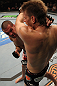 SUNRISE, FL - JUNE 08:   (L-R) Josh Neer punches Mike Pyle in a Welterweight bout during the UFC on FX 3 event at Bank Atlantic Center on June 8, 2012 in Sunrise, Florida.  (Photo by Josh Hedges/Zuffa LLC/Zuffa LLC via Getty Images)