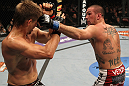 SUNRISE, FL - JUNE 08:   (R-L) Josh Neer punches Mike Pyle in a Welterweight bout during the UFC on FX 3 event at Bank Atlantic Center on June 8, 2012 in Sunrise, Florida.  (Photo by Josh Hedges/Zuffa LLC/Zuffa LLC via Getty Images)